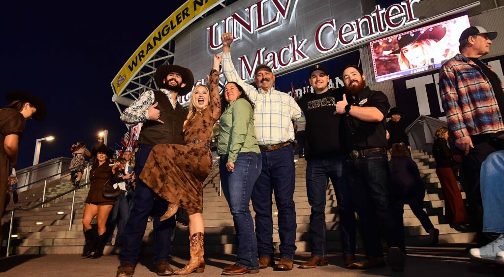 Rodeo fans gathered outside the Thomas & Mack Center at night